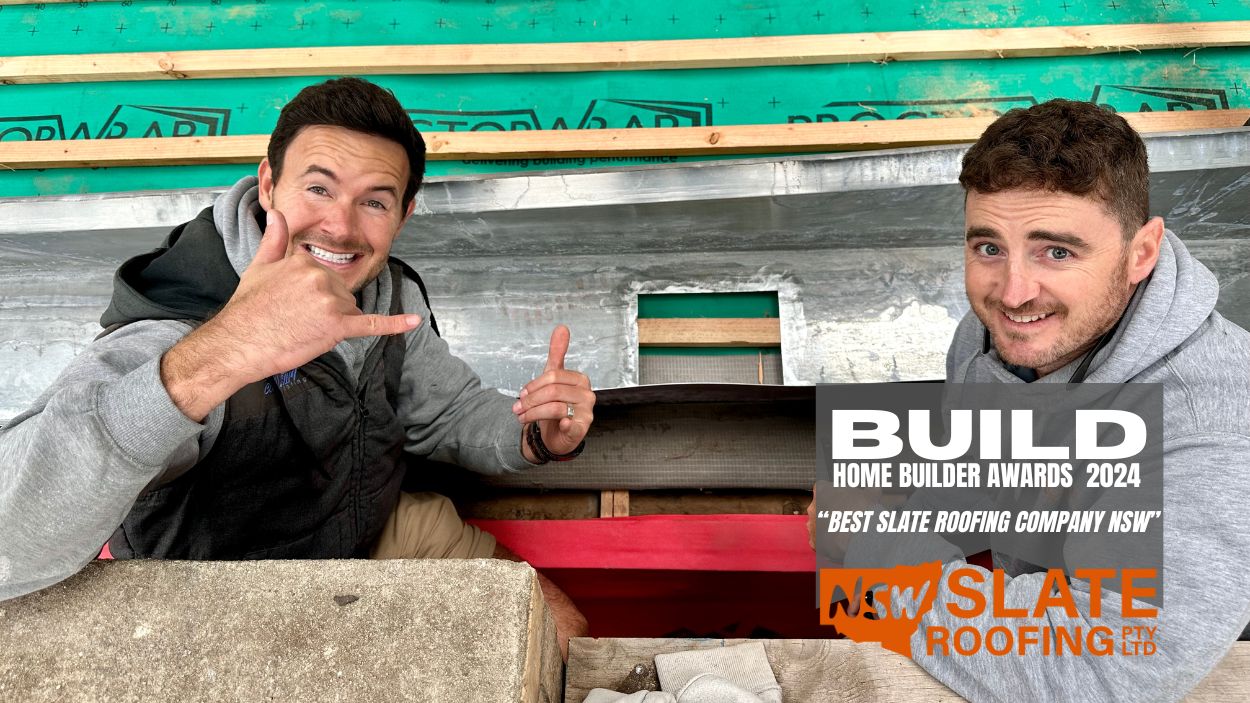 mittagong.before.03 Two men, Kinsley Denning and a teammate, work on a roof for NSW Slate Roofing Sydney, winners of BUILD Awards 2024.